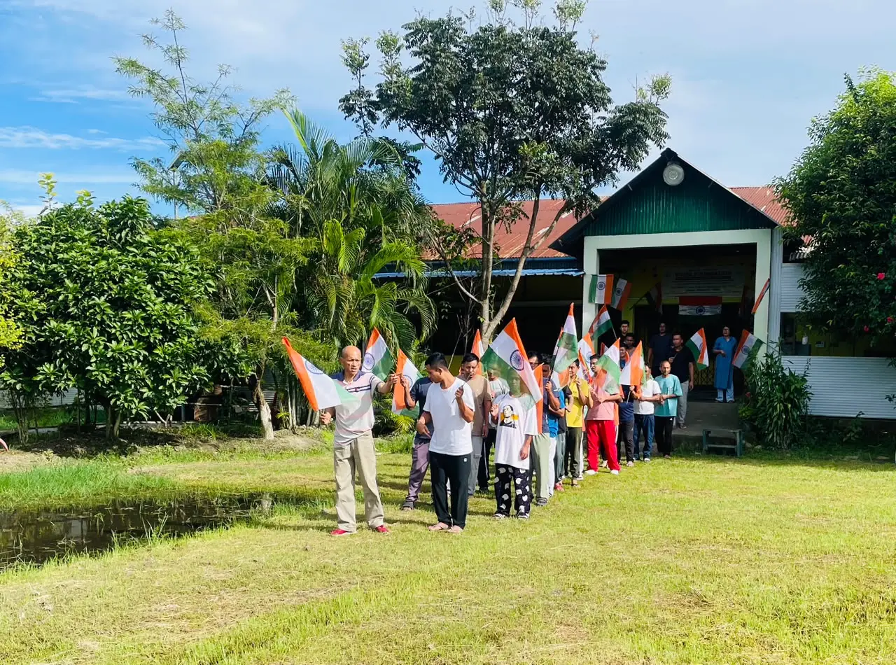 Residents lined up with the Tricolour on the Kripa Foundation IRCA lawn
